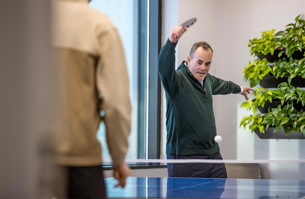 Home 52 Sevan Solutions Jim playing ping pong